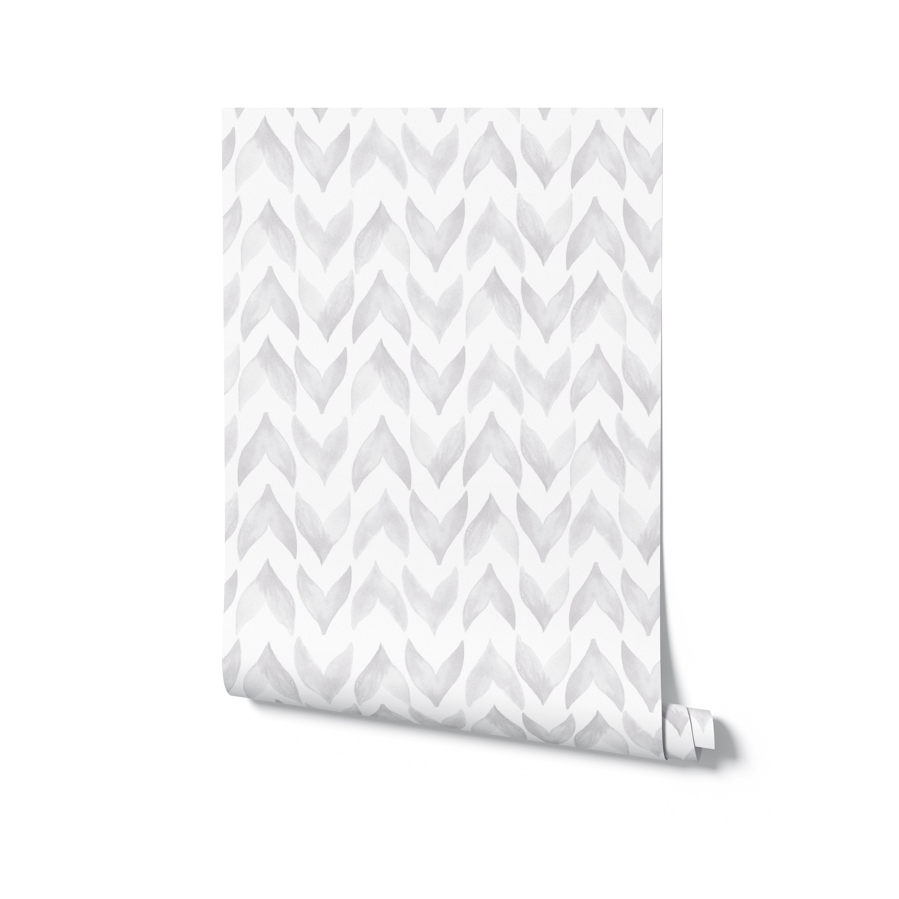 A rolled-up wallpaper sample revealing the Moroccan Tile pattern, which consists of white and light grey watercolor zigzag shapes, giving a sophisticated and contemporary feel to the design.