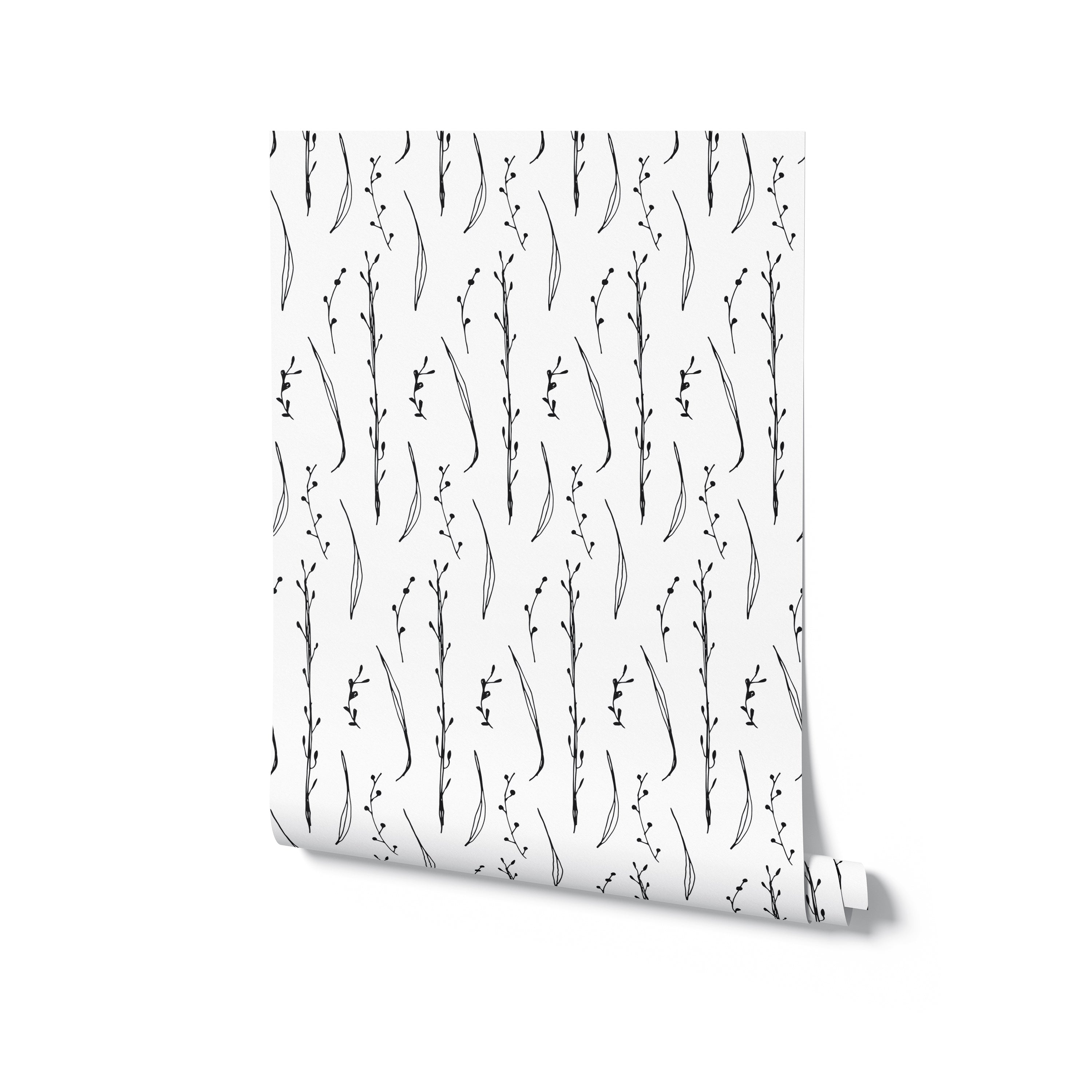 A roll of Twig & Leaf Wallpaper displaying a beautiful black and white pattern of twigs and leaves, perfect for adding a touch of elegance to any room.