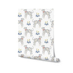 A roll of 'Dog Wallpaper 33' showcasing a playful design of Dalmatians with decorative blue and yellow flowers on a white background, perfect for adding a touch of whimsy to children's rooms or nurseries