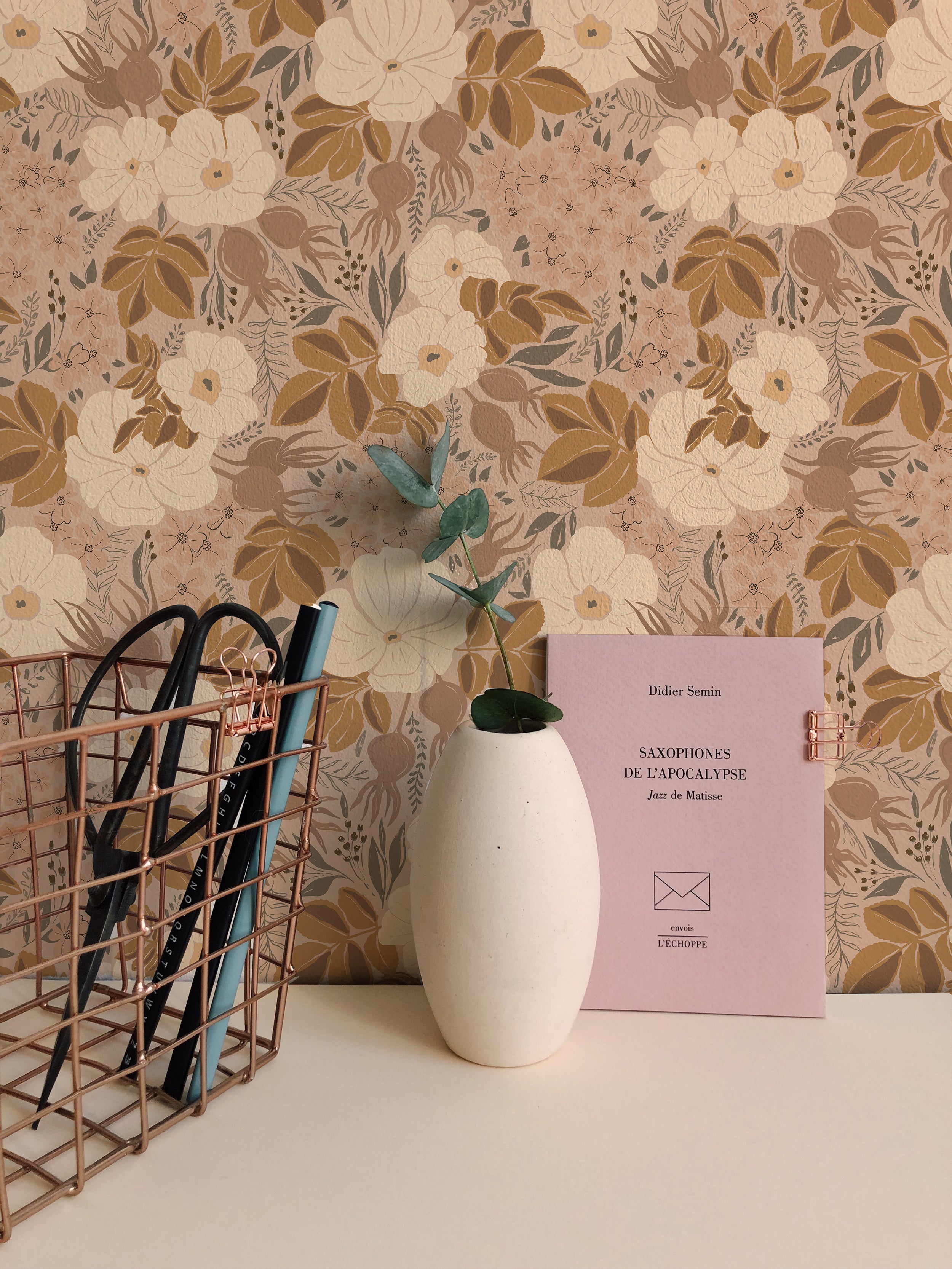 A close-up of the Rosehip Wallpaper showing its intricate pattern of large white flowers, smaller pink blooms, and rich green leaves on a dark background, ideal for adding a touch of nature-inspired elegance to any room.
