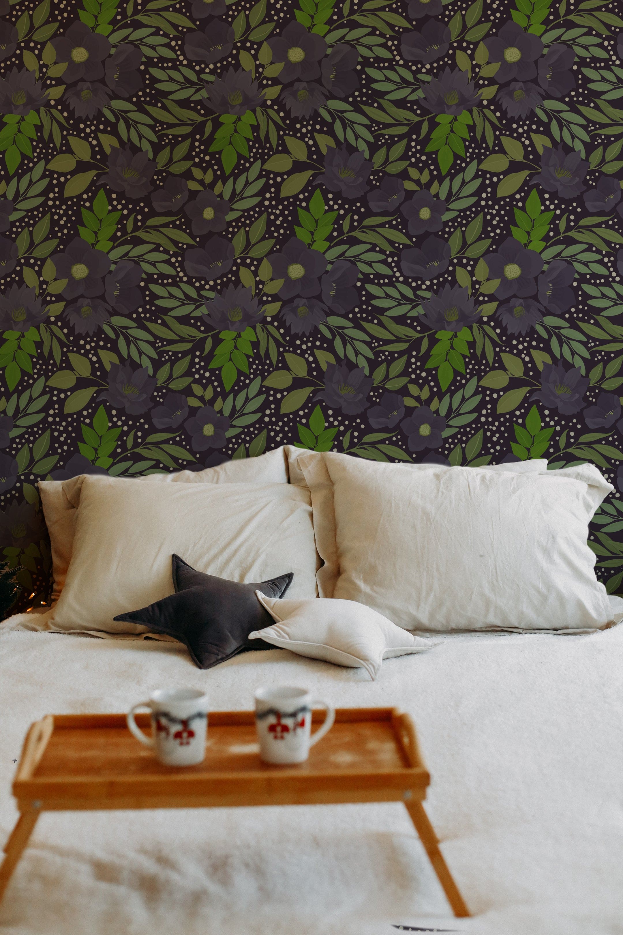 A tranquil bedroom setting where the Martinique Floral Wallpaper adds a dramatic touch with its oversized purple flowers and dense greenery on a deep background. A black cat lounges on a bed with white linens, blending seamlessly into the floral theme.