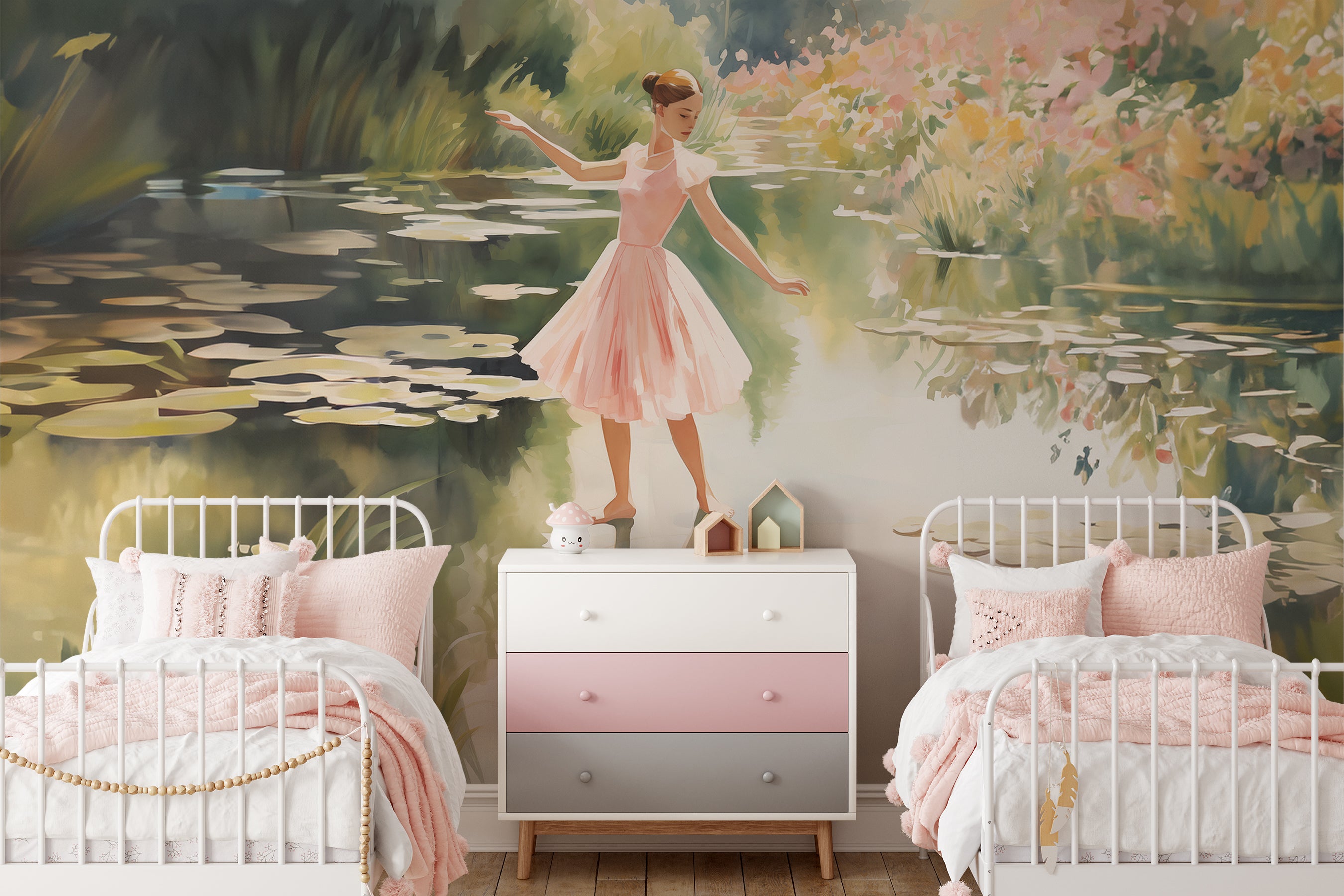 A mural of a young ballerina in a pink dress dancing on the shore of a lily-covered pond in a children's bedroom with two beds and soft pink bedding