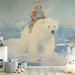 Watercolor style wallpaper featuring a child on a polar bear, enhancing a nursery with 'The Golden Compass Mural.'