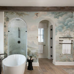 Modern bathroom enhanced with a Loire Valley landscape mural, featuring a freestanding bathtub and tranquil nature scenes."