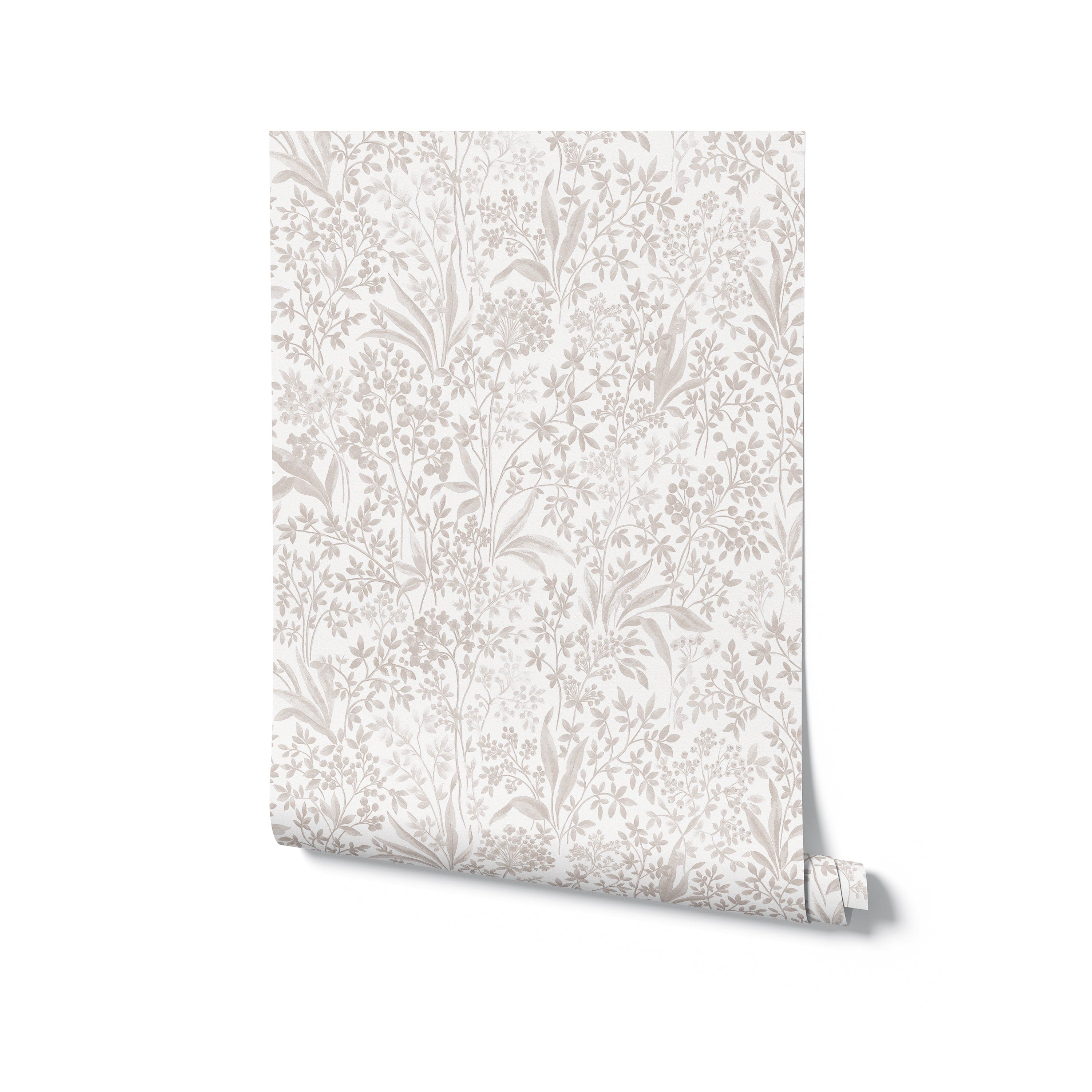 A roll of Harmony in Bloom Wallpaper, highlighting an intricate floral pattern in muted gray and beige hues on a white background. This wallpaper brings a touch of timeless beauty to any room, perfect for creating a serene and stylish space.