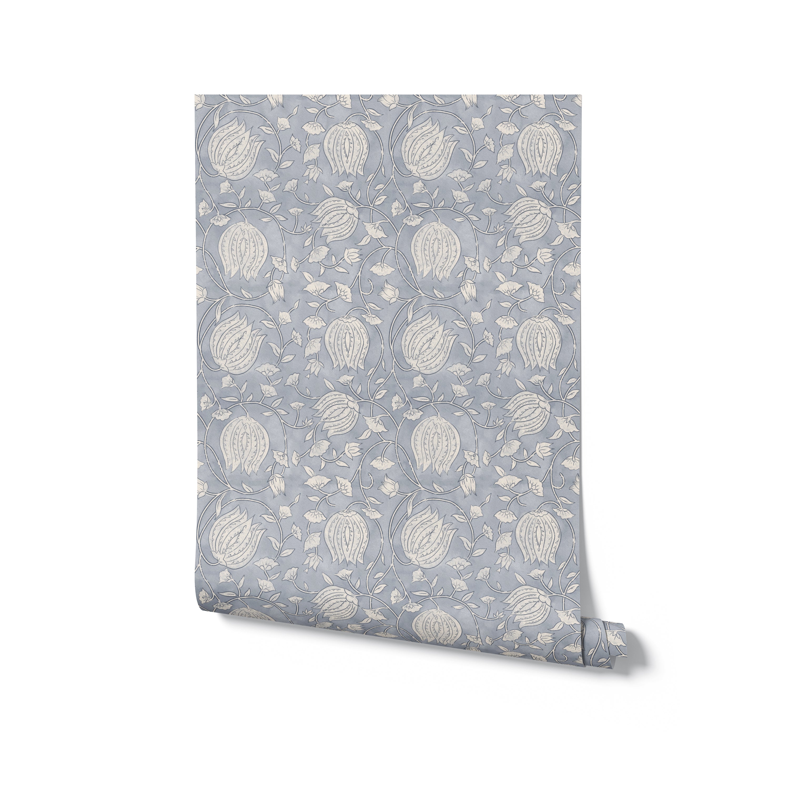 A roll of Cornflower Wallpaper displayed against a plain background, highlighting the intricate pattern of blue and gray flowers and foliage that gives a classic and timeless look to the design.