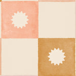 Close-up of the Coralie Wallpaper displaying a watercolor-style grid pattern in soft peach, beige, and gold hues, each square featuring a subtle sunburst design that adds a touch of elegance
