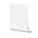 Roll of modern wallpaper with an organic, geometric pattern of loosely drawn rectangles in beige on a white background, suggesting a simple yet stylish decor option for contemporary spaces.