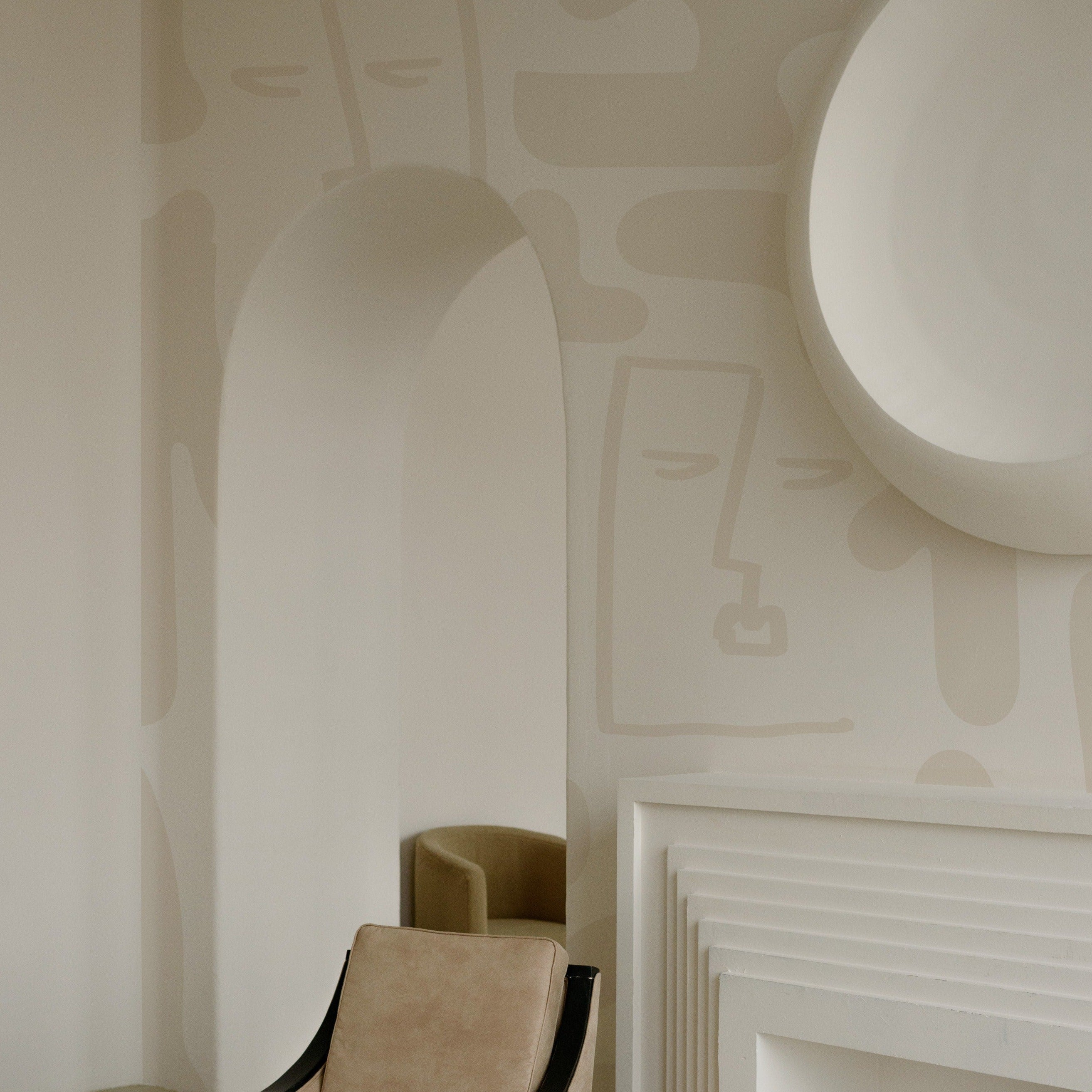 Minimalist Boho Wallpaper with abstract linear faces and organic shapes in neutral beige tones, adorning a living room with elegant decor, including an armchair and a modern fireplace.