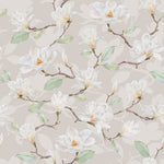 A close-up view of a watercolor magnolia wallpaper, displaying intricate details of magnolia flowers and branches on a neutral beige background, enhancing the wall with a touch of nature.