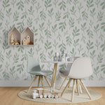 Children’s play area decorated with Easter Leaf Wallpaper, displaying a gentle pattern of light green leaves against a white backdrop, contributing to a calm and soothing environment alongside modern furnishings.