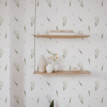 Summer Market Wallpaper in a serene living space, with subtle floral and foliage designs in pastel shades, complementing minimalist wooden shelving and modern decor, creating a fresh and inviting atmosphere.
