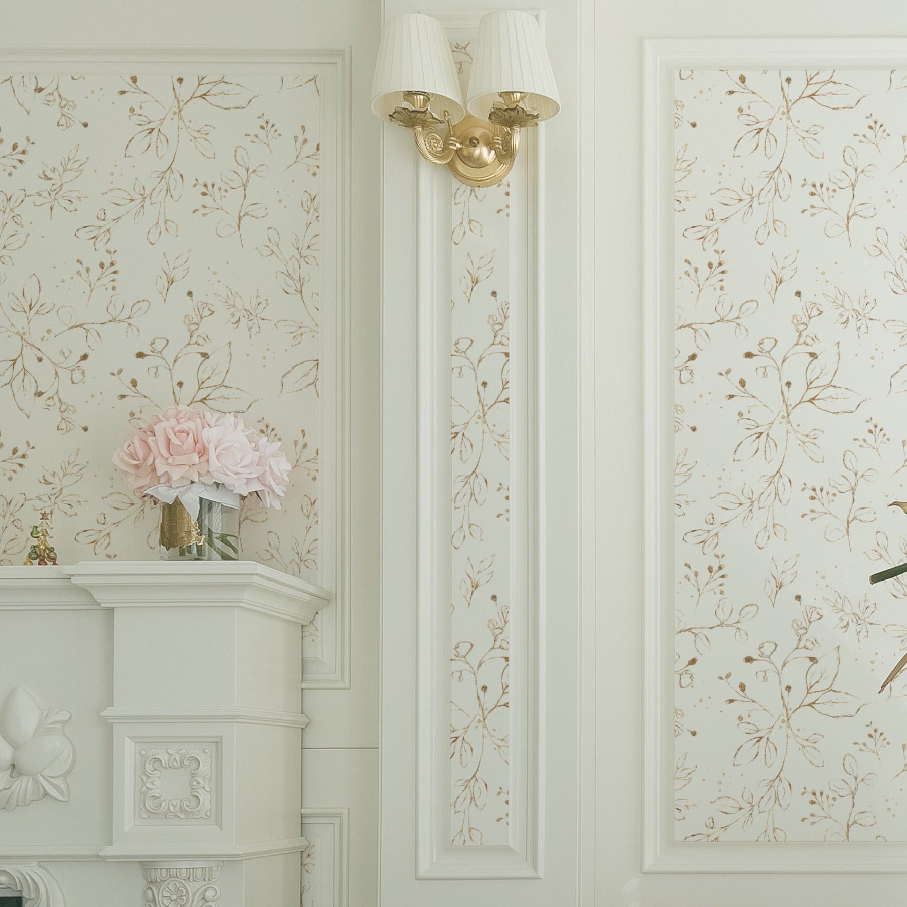 The Gold Leaves Wallpaper graces a classic room with white molding and elegant decor, adding a touch of sophistication with its golden watercolor leaves against the soft background.