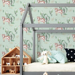 A child's bedroom beautifully adorned with Watercolor Farm Animals III wallpaper, featuring a charming pattern of cows and trees, complemented by a modern loft bed and whimsical room accessories