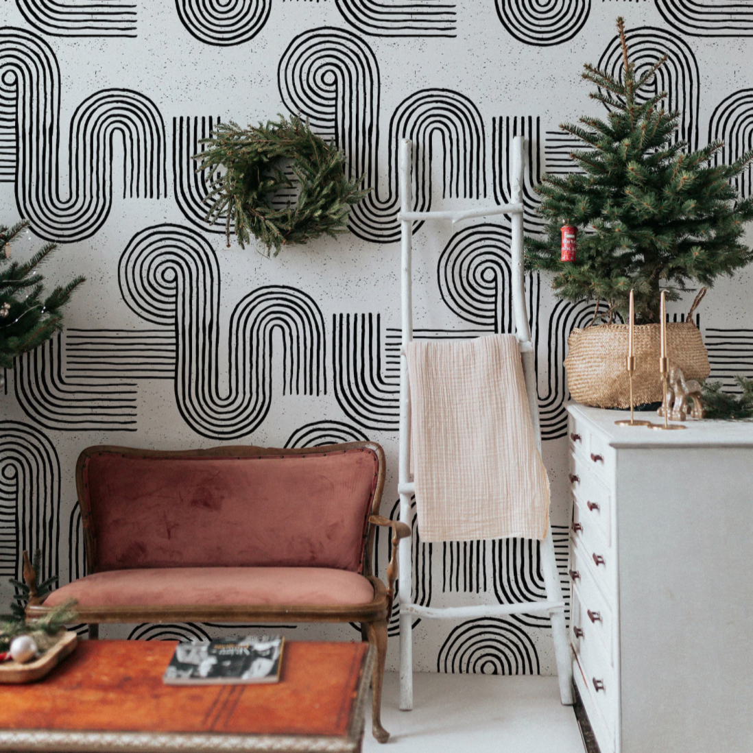 A cozy living space enhanced by the Zen Abstract Wallpaper, which provides a bold yet tranquil background to the vintage furniture and holiday decor, evoking a sense of modern serenity.