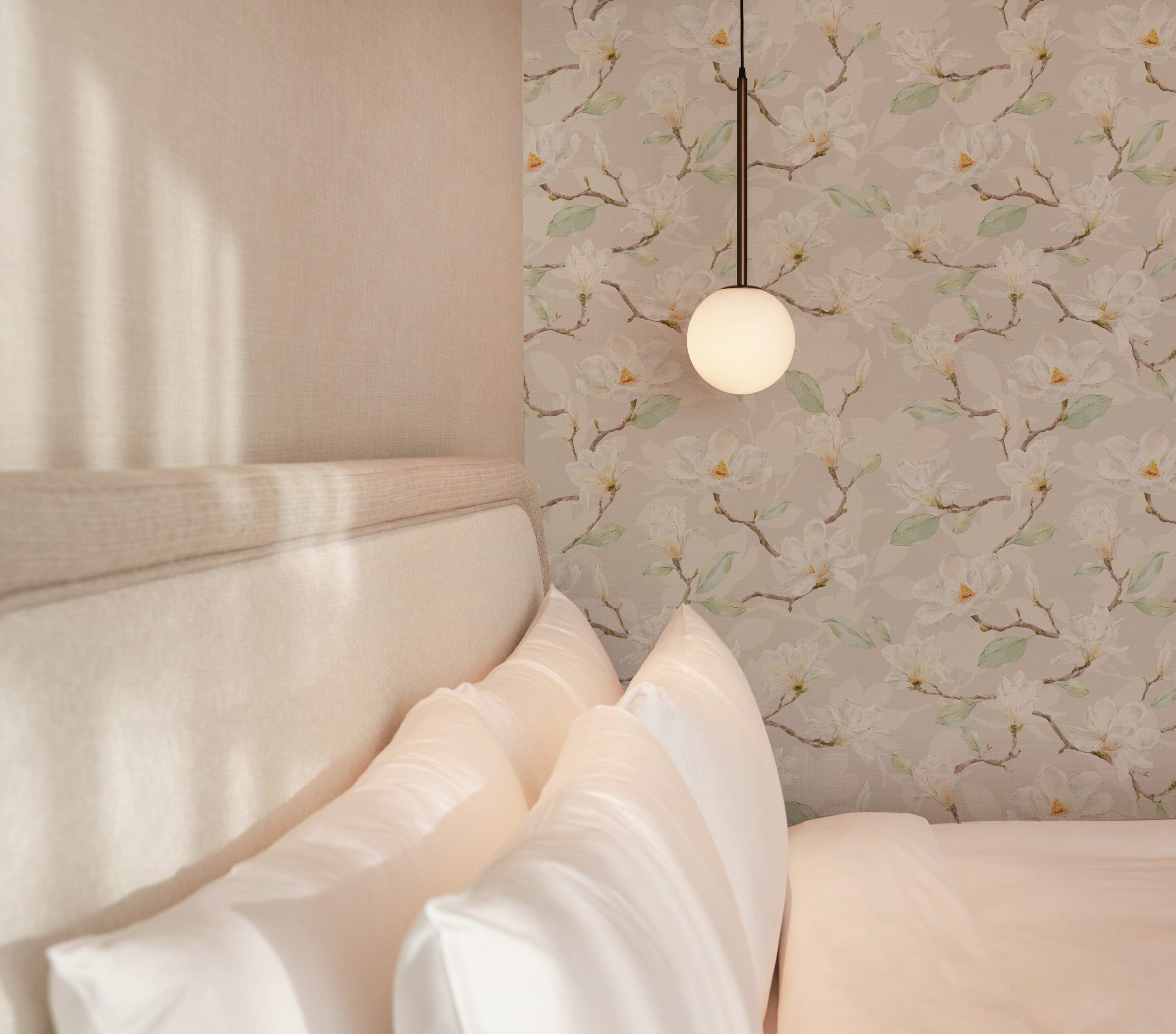 A serene bedroom setup with a single bulb pendant light casting a soft glow on a wall covered in gentle magnolia floral wallpaper, creating a relaxing and inviting atmosphere.