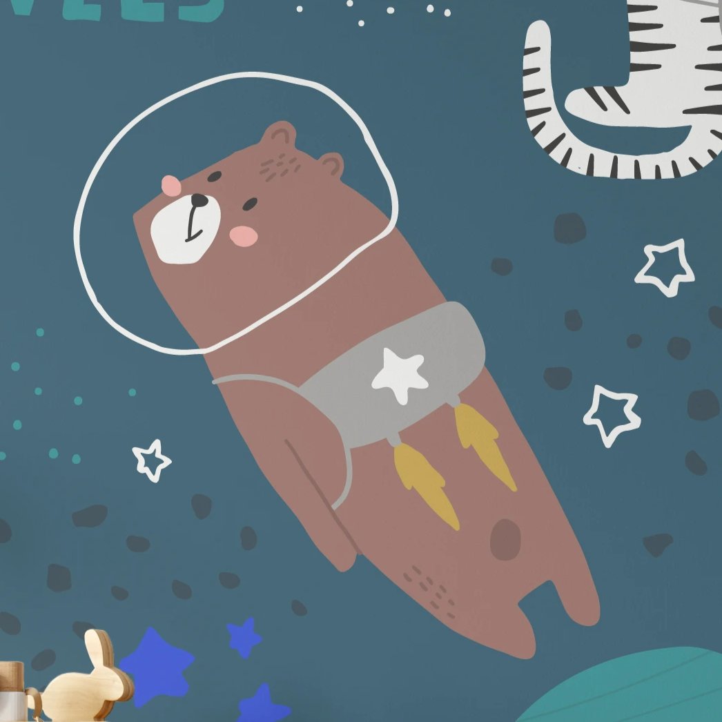 A whimsical illustration of a brown bear wearing a space helmet and a jetpack with yellow flames, floating in space against a dark blue background. The bear has a cheerful expression, adding a playful touch to the design.