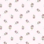 Close-up view of the Daphne Floral Wallpaper displaying a charming pattern of tiny pink flowers and green leaves on a pale background, offering a fresh and cheerful look suitable for light and airy interior designs.
