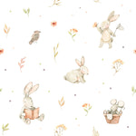 A close-up view of the Watercolour Bunnies Wallpaper, featuring charming illustrations of bunnies in various playful activities like reading and holding a butterfly net, interspersed with delicate flowers and leaves in a soft watercolor style on a white background.