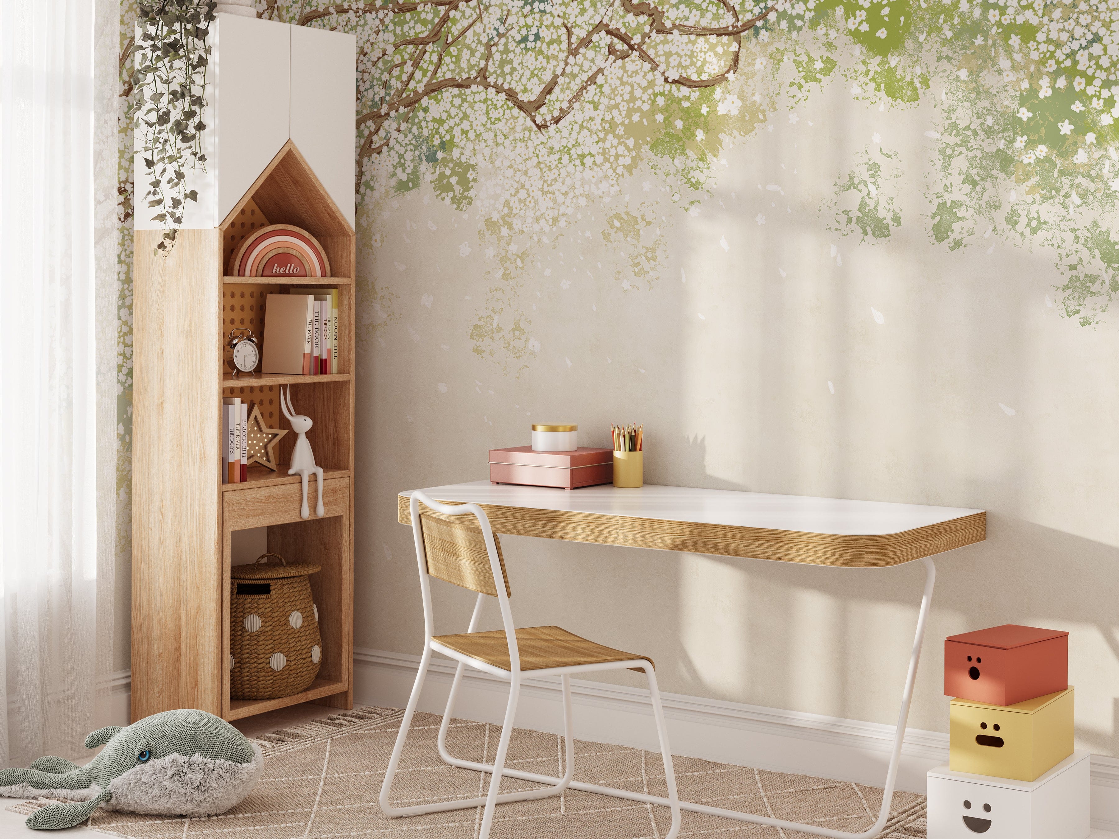 A well-organized study nook with a wooden desk, chair, and a tall bookshelf against a wall featuring the Sakura Serenade mural wallpaper. The wallpaper's design of cherry blossom branches with white flowers on a soft green and beige background adds a serene and elegant ambiance to the space.