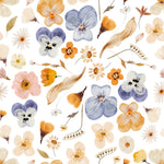 Close-up view of the Blooming Boho Floral Wallpaper showcasing a detailed pattern with a variety of flowers in shades of blue, orange, and cream, along with green leaves and tan sprigs. The wallpaper exudes a warm, inviting bohemian vibe with its watercolor aesthetics.
