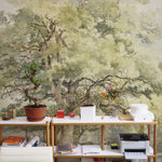 An office space where the Boomstudie Vintage Wall Mural creates a peaceful work environment. The mural, illustrating a dense tree with intricate branches and leaves, spans the entire wall, pairing beautifully with simple office furniture and decorative items to inspire creativity.