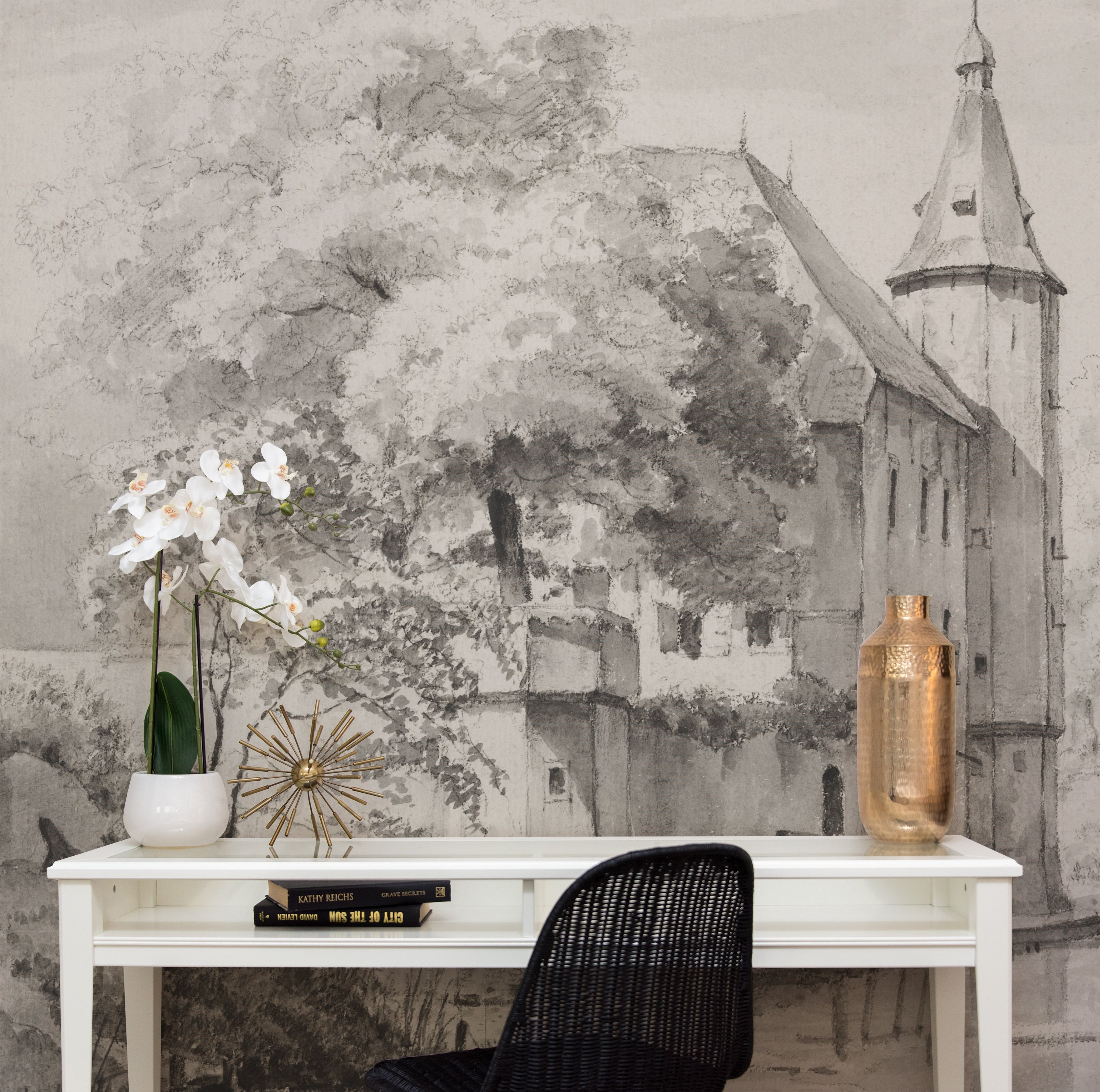 Sophisticated office space featuring the 'Kasteel Soelen - Wall Mural Wallpaper'. The intricate castle depiction in muted grey tones provides a tranquil and inspiring backdrop for creative work