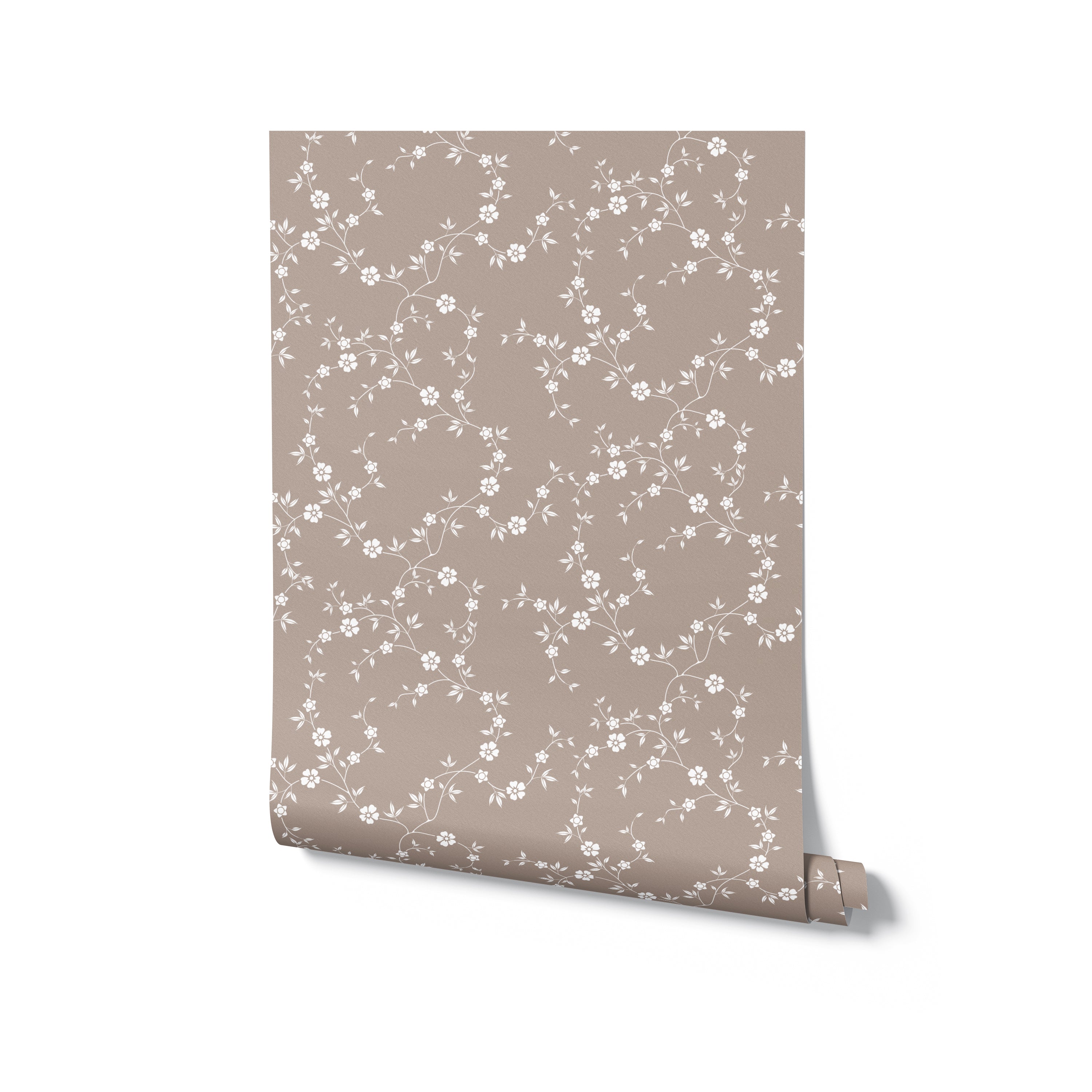 A rolled-up section of the Charming Floral Wallpaper II in a beige background with white floral patterns. The delicate floral design creates a light and airy feel.