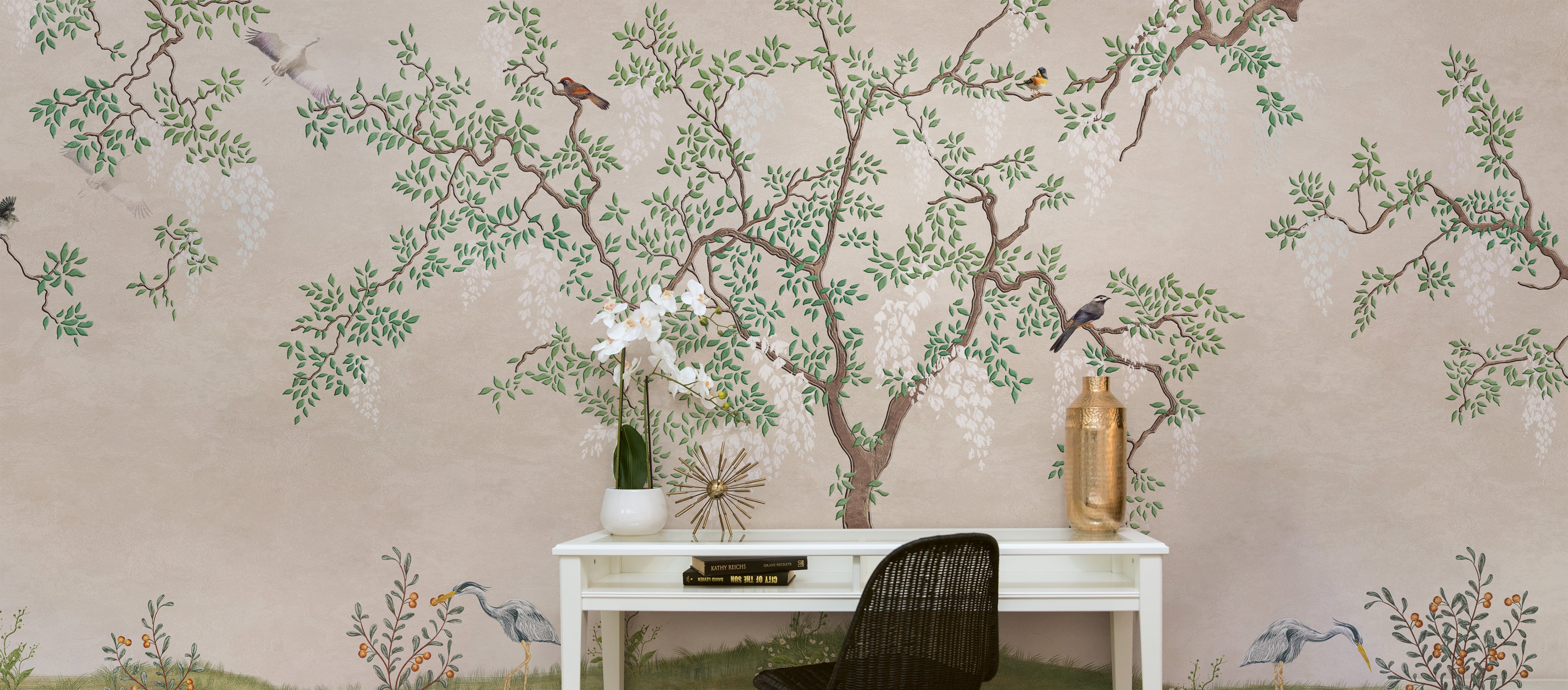 A panoramic view of the Chinoiserie - Wallpaper Mural, depicting an expansive and beautifully detailed scene of a tree with lush green leaves and intricate branches. Various birds, including herons and small songbirds, animate the scene, adding a dynamic element to the serene backdrop.