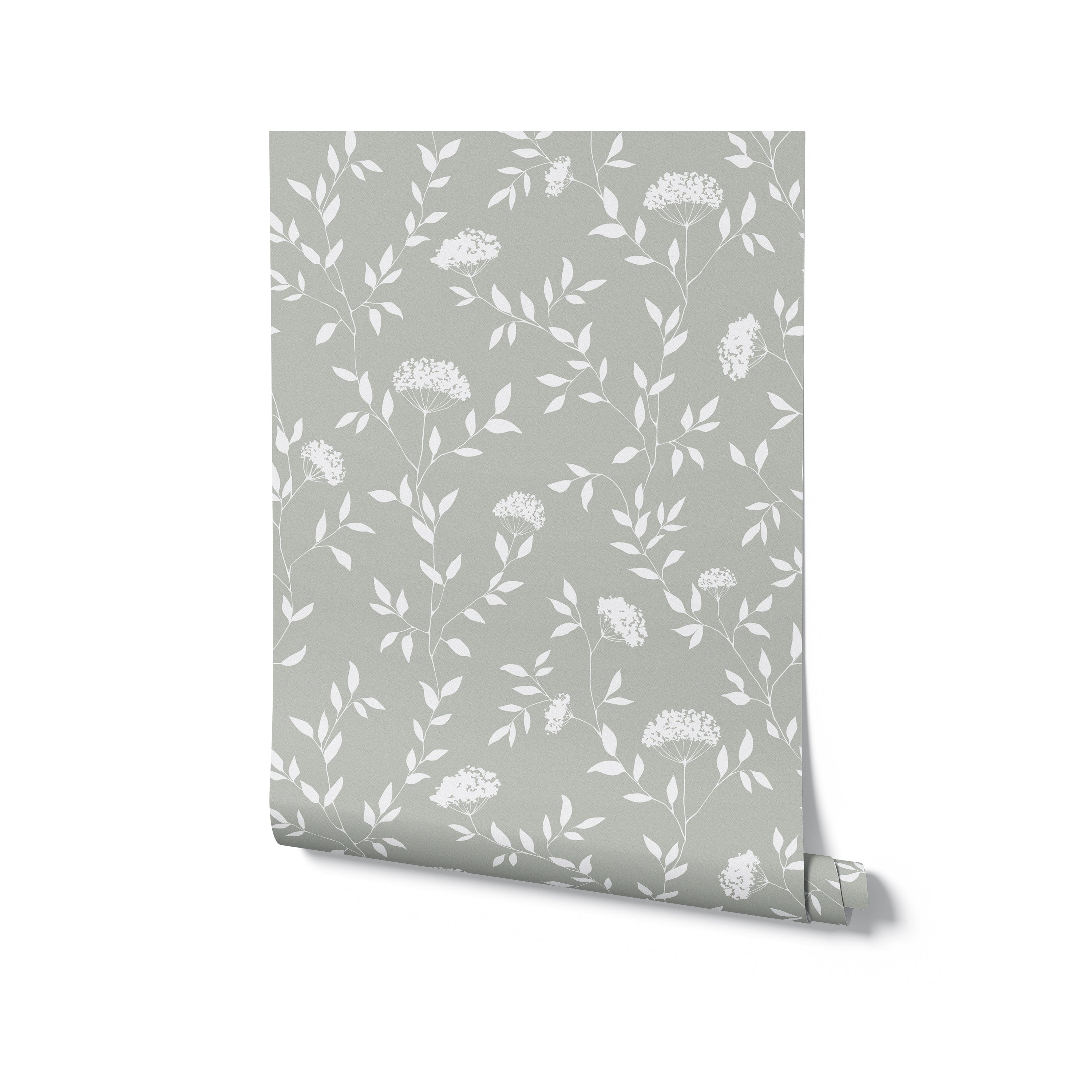 This image depicts a roll of the Botanical Elegance Wallpaper-Olive standing against a white background. The roll is partially unrolled, revealing the wallpaper's olive base and white botanical print. The design is consistent throughout, with a pattern of branches and floral motifs that suggests a tranquil natural setting. This image gives an idea of the wallpaper's texture and quality, as well as how it might look before installation.