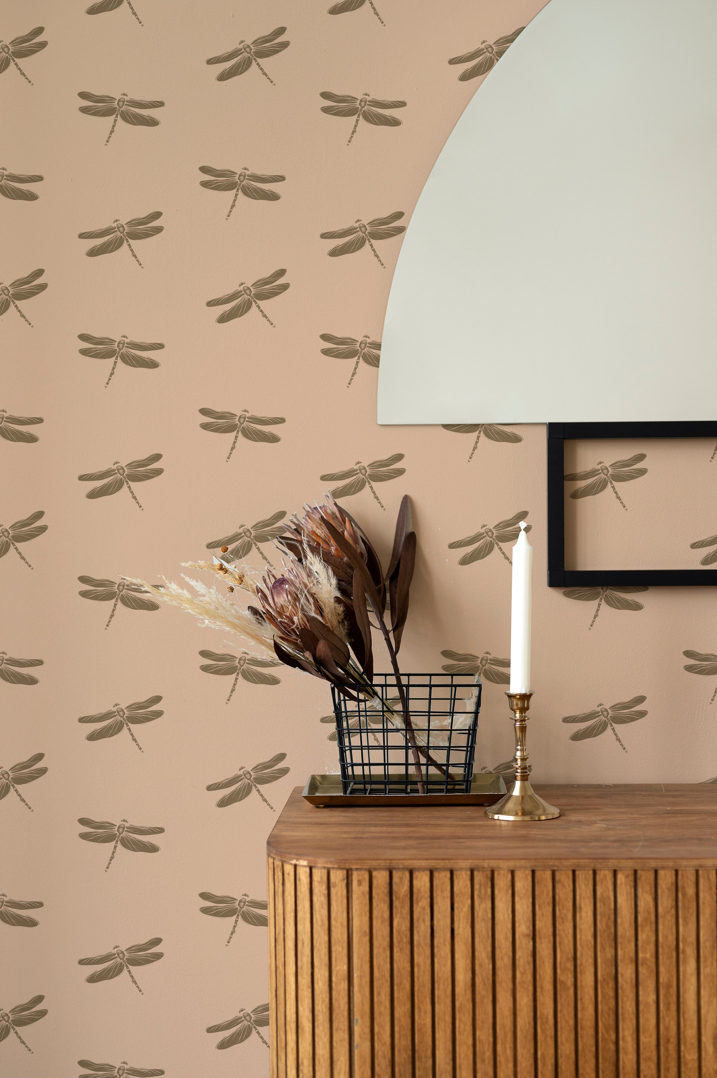 A room showcasing Autumn Dragonfly wallpaper, enhancing the space with its delicate dragonfly motifs in soft beige and brown, complemented by a wooden sideboard and natural decor elements.