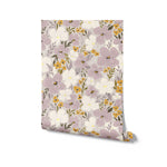 A rolled-up view of the Fleur Wallpaper showcasing a detailed pattern of soft purple, white, and yellow flowers with green foliage on a neutral background, providing a sense of depth and natural beauty.