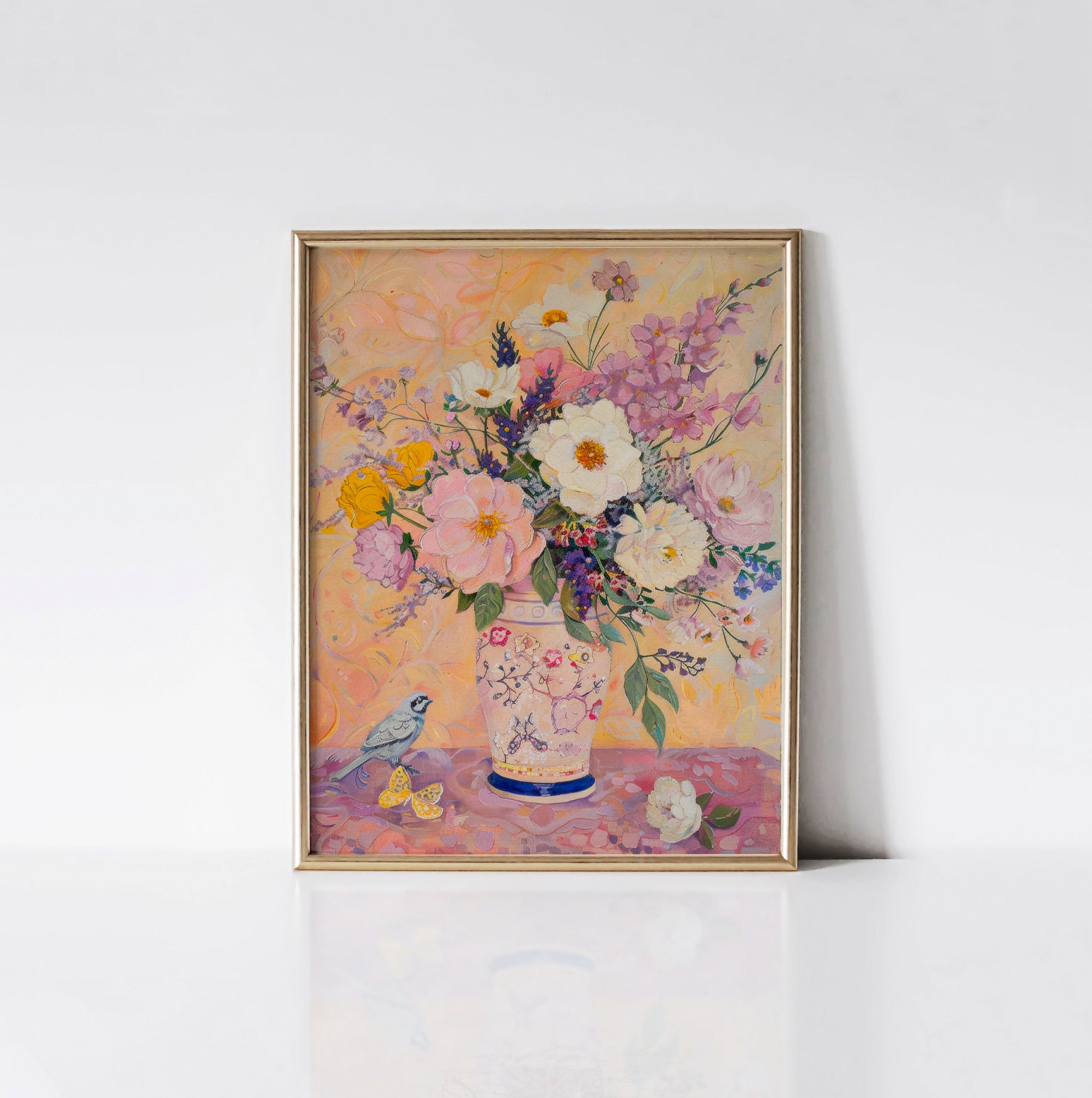 Blooming Melody Art Print framed in an elegant gold frame, featuring a vibrant floral arrangement with pink, yellow, and white flowers, complemented by a bird and butterflies.