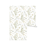 A rolled view of the "Daisy Bouquet Wallpaper - Large" displaying its full design of white daisies and green foliage. This wallpaper offers a fresh and lively feel, perfect for adding a touch of nature’s tranquility to any room, from living areas to bedrooms.