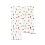 Rolls of School Bus Wallpaper showcasing its vibrant pattern with colorful cars, buses, houses, and trees on a white background, perfect for adding a playful touch to any children's room.