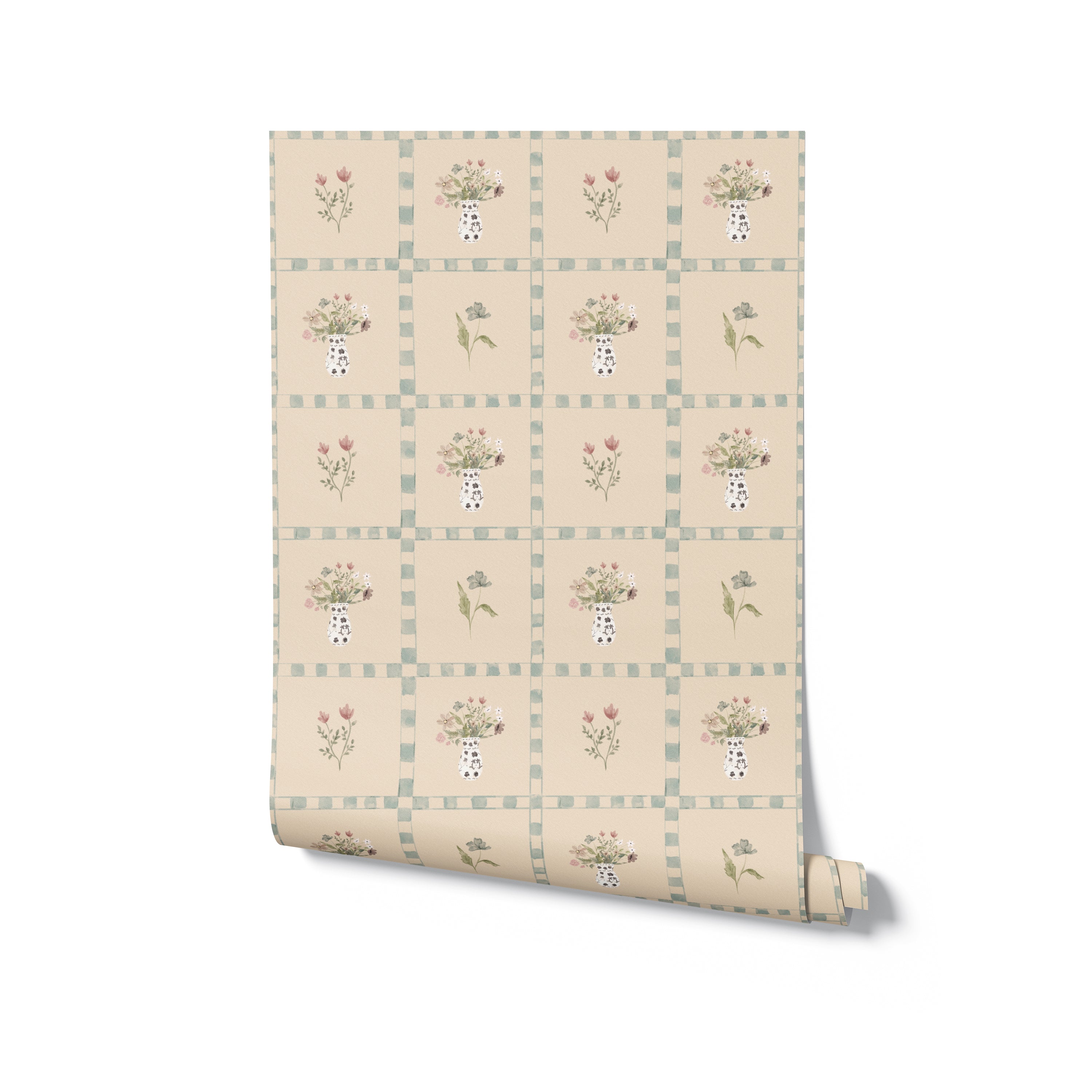 A roll of Cottage Bouquet Wallpaper, showcasing its charming pattern of floral arrangements in vases and individual blooms within a checkered grid design in soothing pastel hues, perfect for adding a cottagecore vibe to any room.