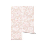 Two rolls of Soft Pastel Pink Floral Wallpaper showcasing an elegant array of hand-painted style flowers in soft pink hues on a pale pink background, symbolizing serenity and grace.