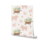 Roll of Spring Farm Wallpaper with pig and wheelbarrow patterns on a light background, ideal for home decor.