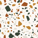 A close-up view of the Earthy Terrazzo wallpaper design featuring a pattern of irregularly shaped fragments in muted shades of orange, green, gray, and white scattered across a creamy background.
