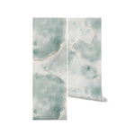 Rolled Shimmering Marble Wallpaper featuring a vibrant and textured blue and green marble pattern with golden accents, displayed against a plain background to highlight the design's details and colors.