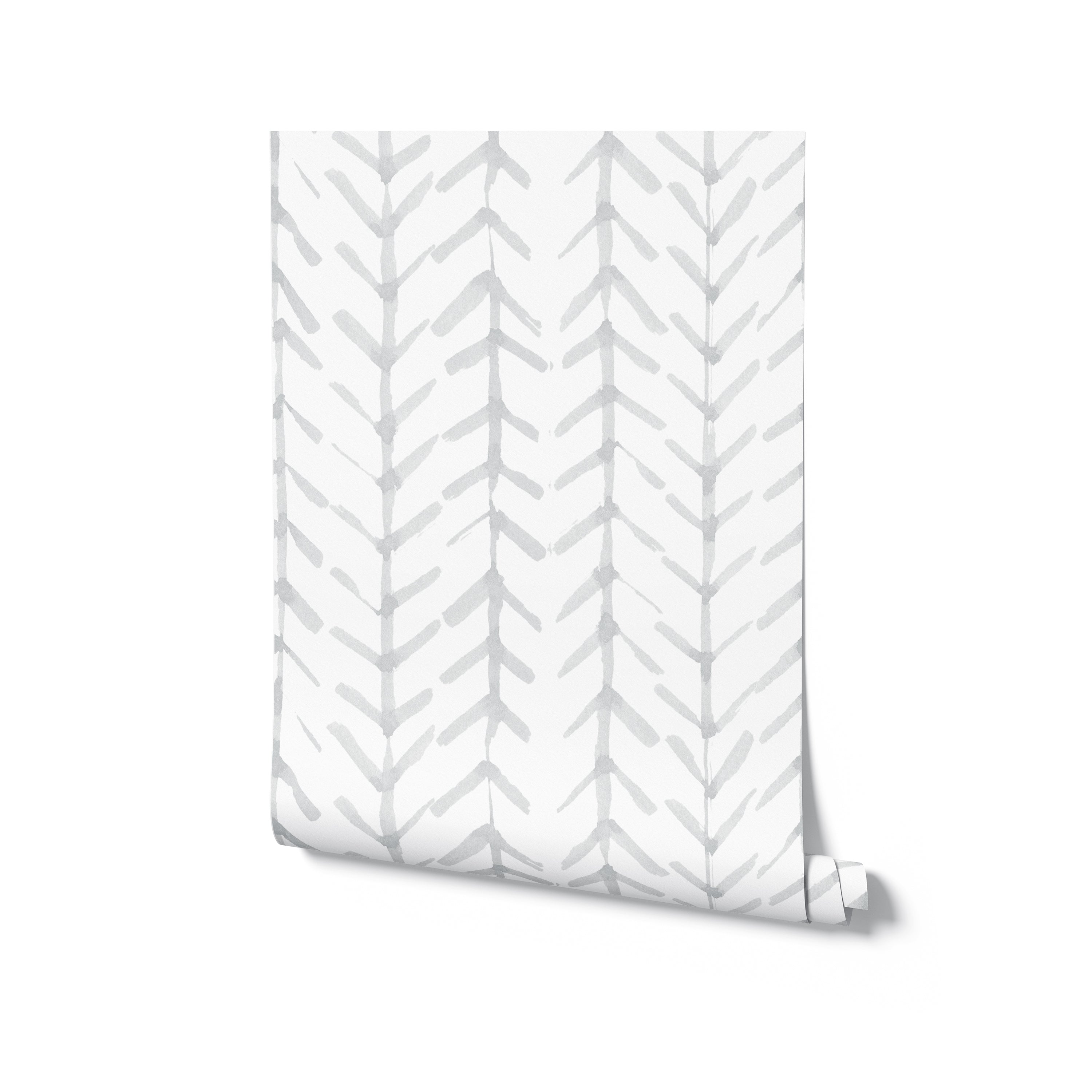 A roll of Hand Painted Chevron Arrow Wallpaper with the soft gray arrow pattern visible, symbolizing a handmade and bespoke touch for interior decor, ready to unroll and transform a space with its subtle, artistic vibe