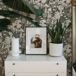 side table with green mushroom wallpaper