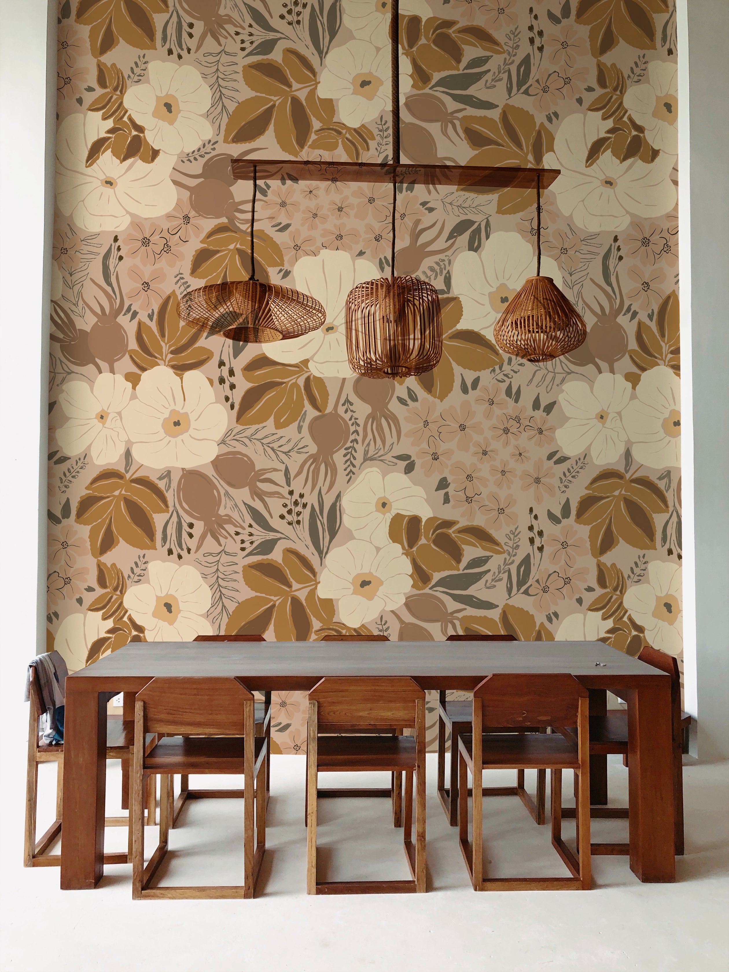 A stylish dining room featuring a large, bold floral wallpaper with neutral tones. The room includes a dark wooden dining table, flanked by matching chairs, under unique woven pendant lights.