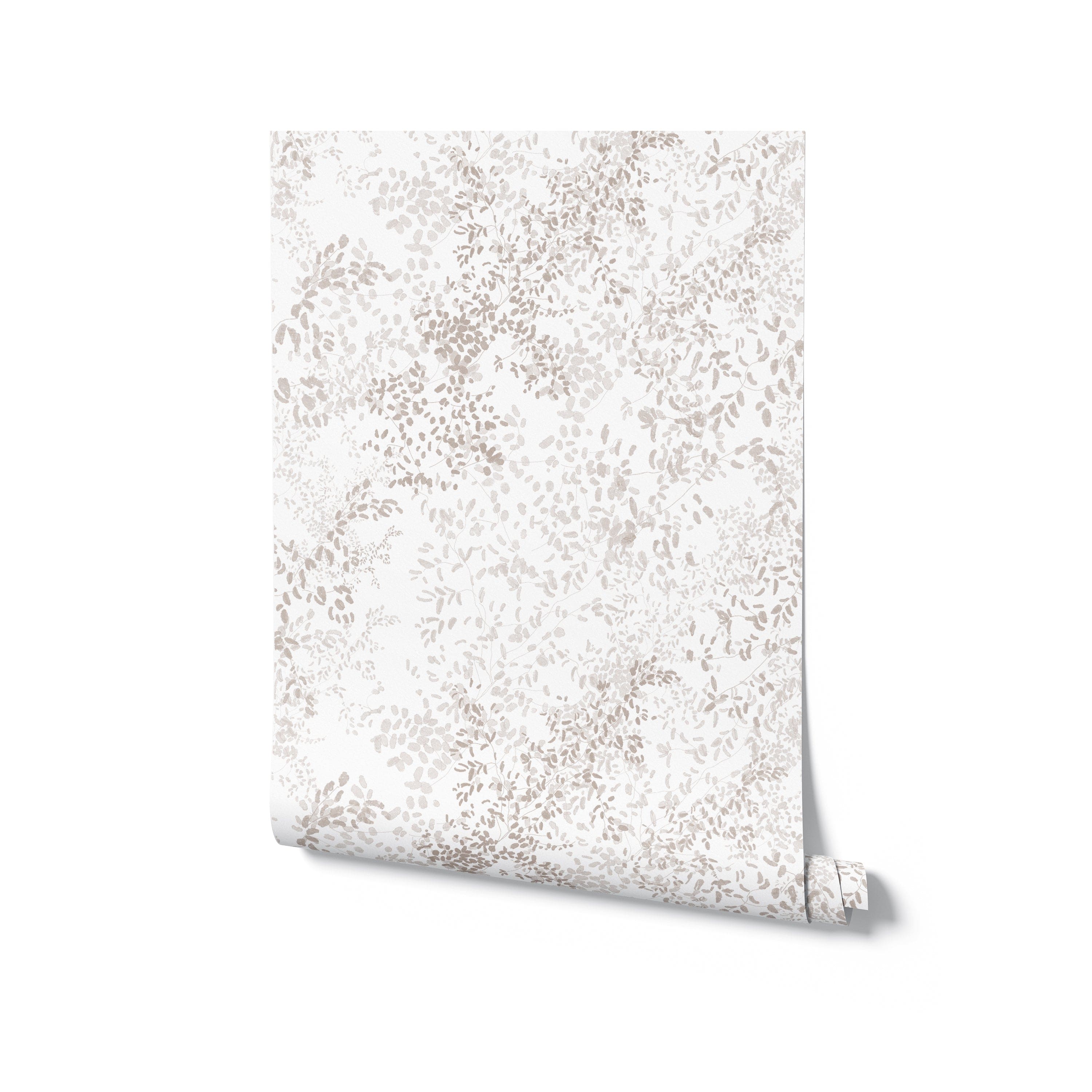 A roll of Golden Delicate Winter Floral wallpaper, partially unrolled to reveal a lush pattern of delicate beige floral motifs spread across a white background, suitable for adding a touch of elegance to any room.