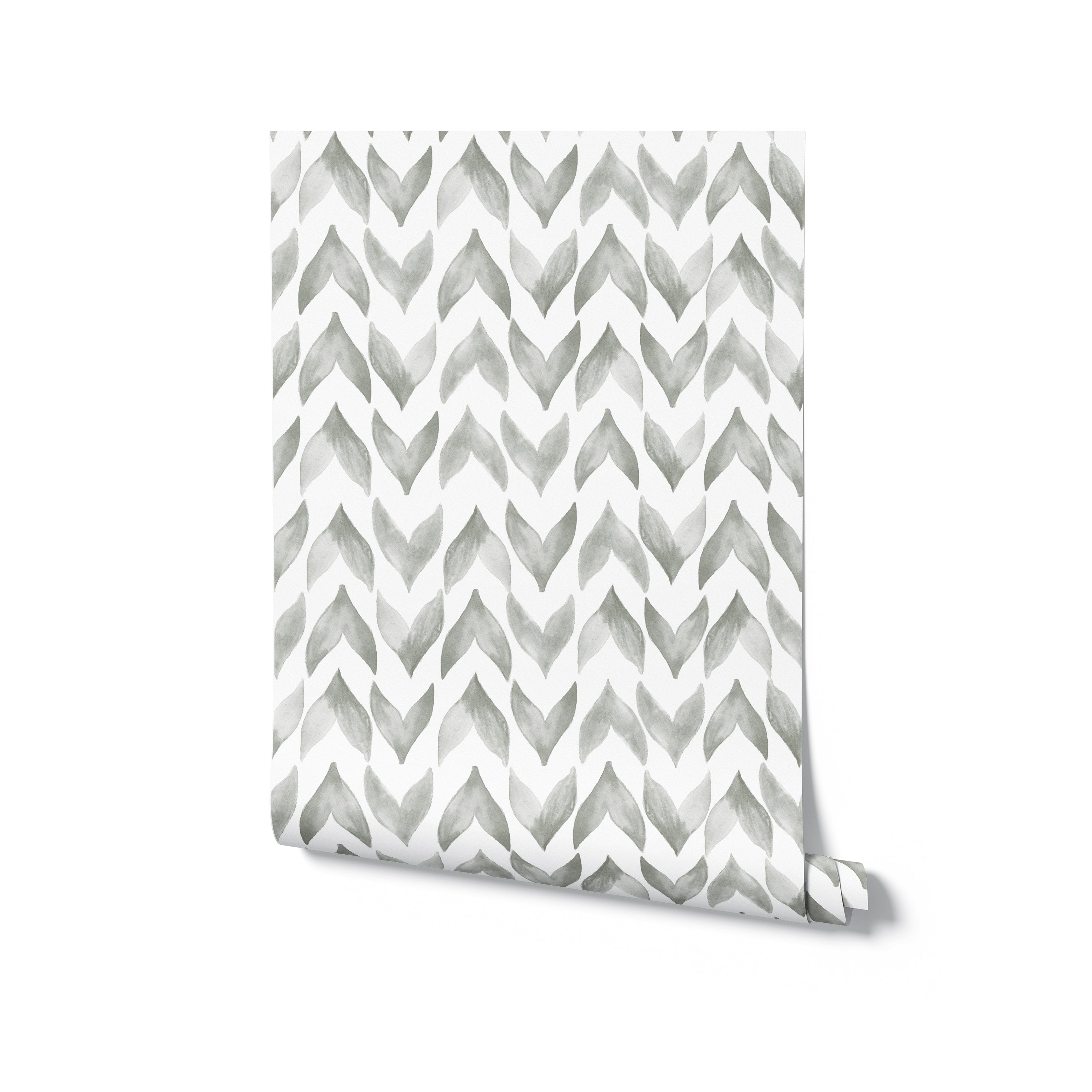 A rolled-up wallpaper sample revealing the Moroccan Tile pattern, which consists of white and gray watercolor zigzag shapes, giving a sophisticated and contemporary feel to the design.