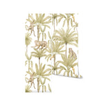A roll of Magic Morocco Jungle Wallpaper, showcasing an enchanting scene of palm trees, monkeys, and elephants in a detailed jungle illustration, perfect for adding an adventurous touch to any room