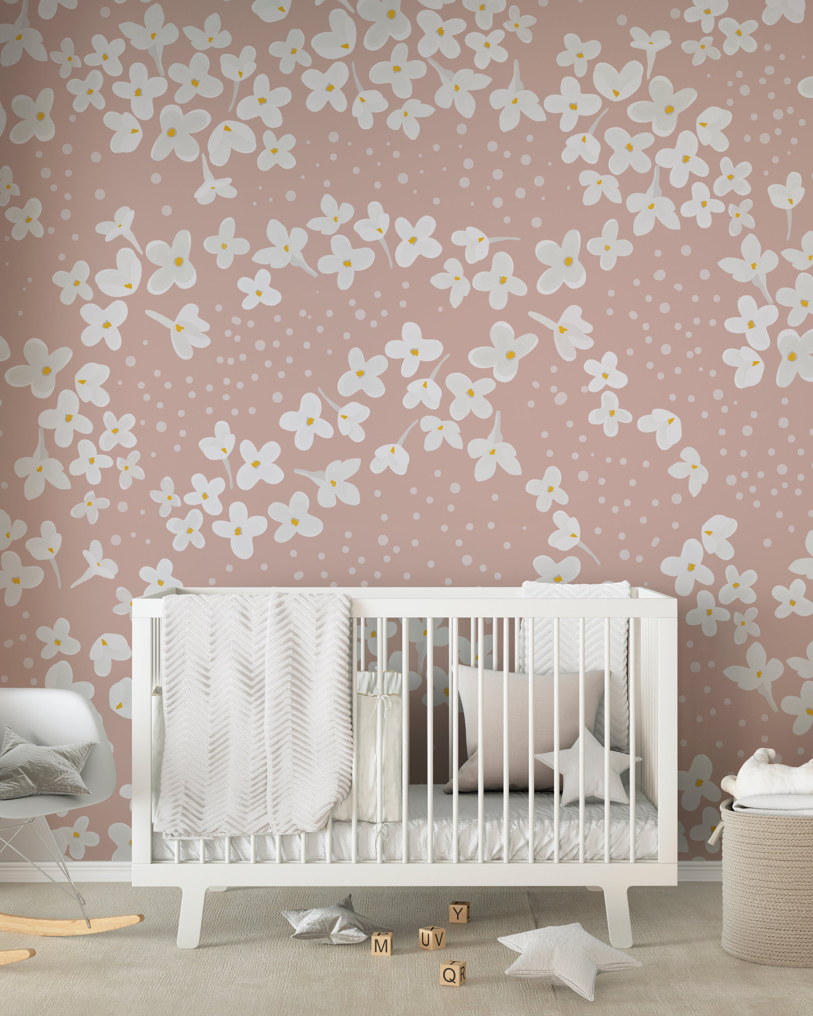 A nursery room decorated with Fleur de Printemps Wallpaper, offering a delightful scene with large white flowers and soft dots that create a playful yet serene environment.