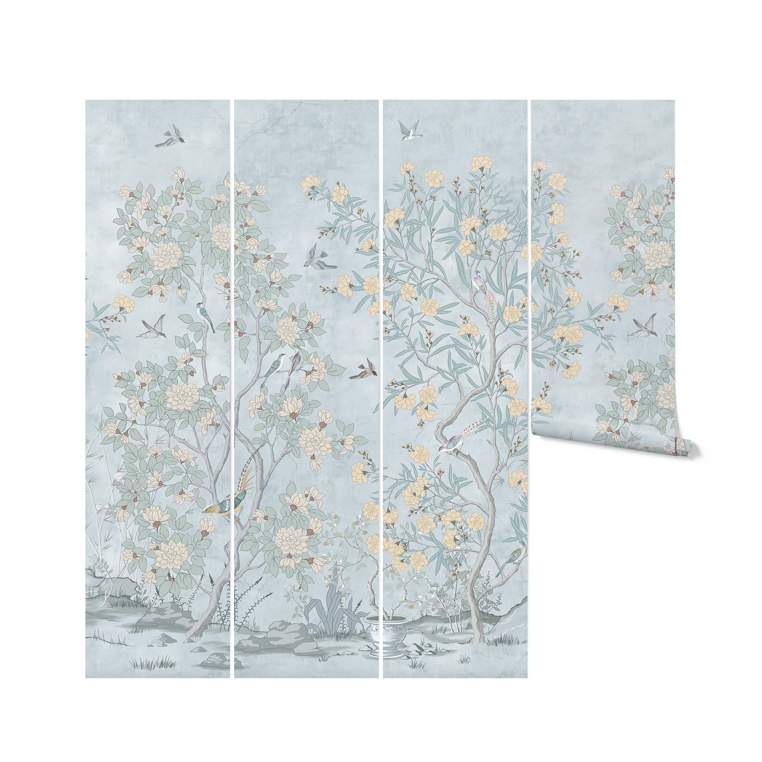 Rolls of chinoiserie wallpaper featuring a sophisticated botanical print with birds. The pattern depicts slender trees with large blooms and leaves in soft hues of green and yellow on a soothing light blue background, creating a serene and elegant design ideal for a calm interior ambiance