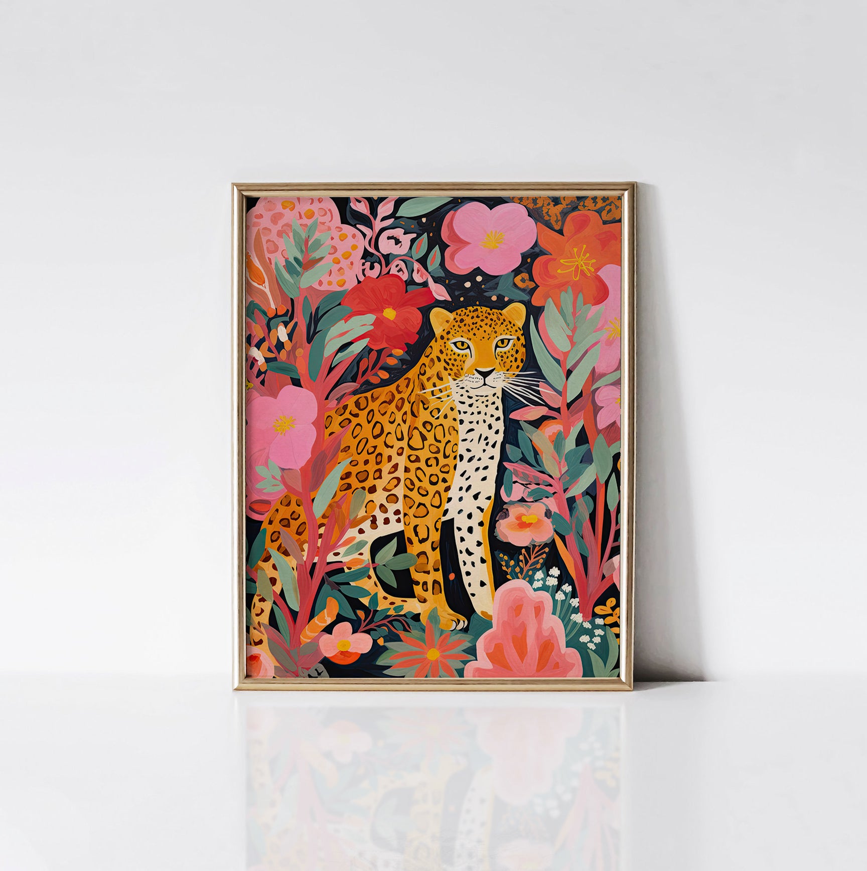 Vibrant Floral Leopard Serenity art print displayed in a sleek gold frame, featuring a majestic leopard nestled among lush tropical foliage in pink, green, and orange tones