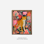 Vibrant art print of a leopard amidst lush tropical foliage, framed in a rustic wood frame, with bold pink, green, and orange colors.
